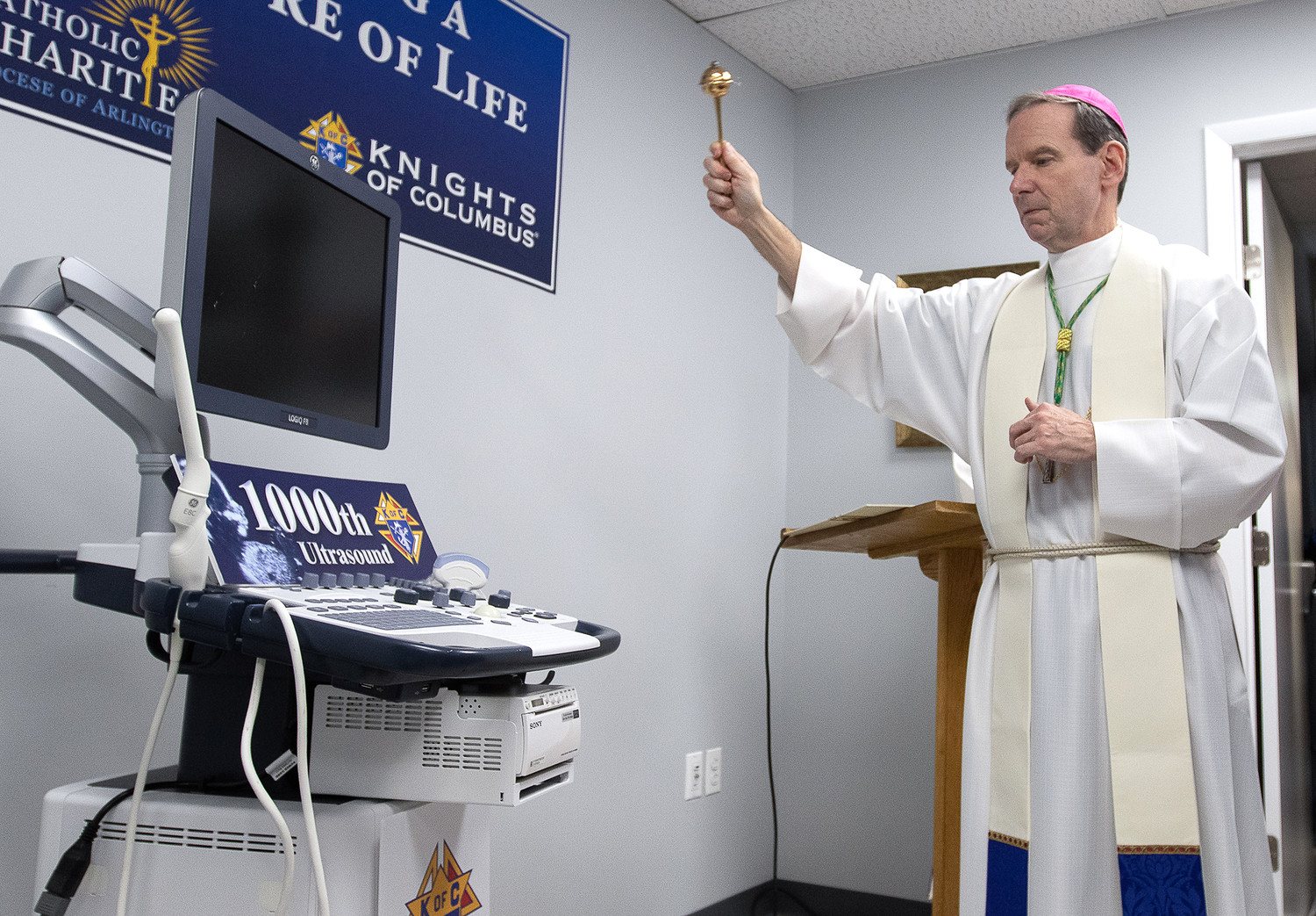 Bishop Michael F. Burbidge of Arlington, Va., blesses the new ultrasound machine for the Mother of Mercy Free Clinic in Manassas, Virginia